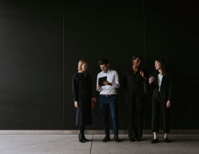 business-professionals-collaborating-in-front-of-a-2026-06-25-20-04-23-utc (1)