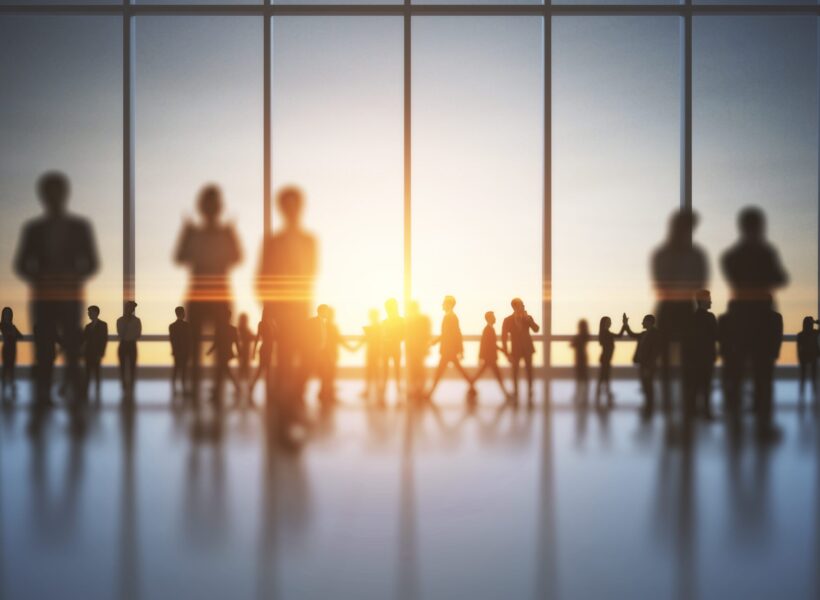 backlit-crowd-of-business-people-working-together-2026-03-26-05-31-36-utc